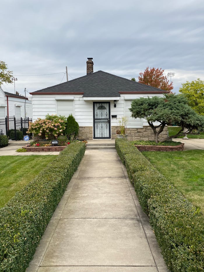 Charming suburban house with well-kept garden in Gary, Indiana.